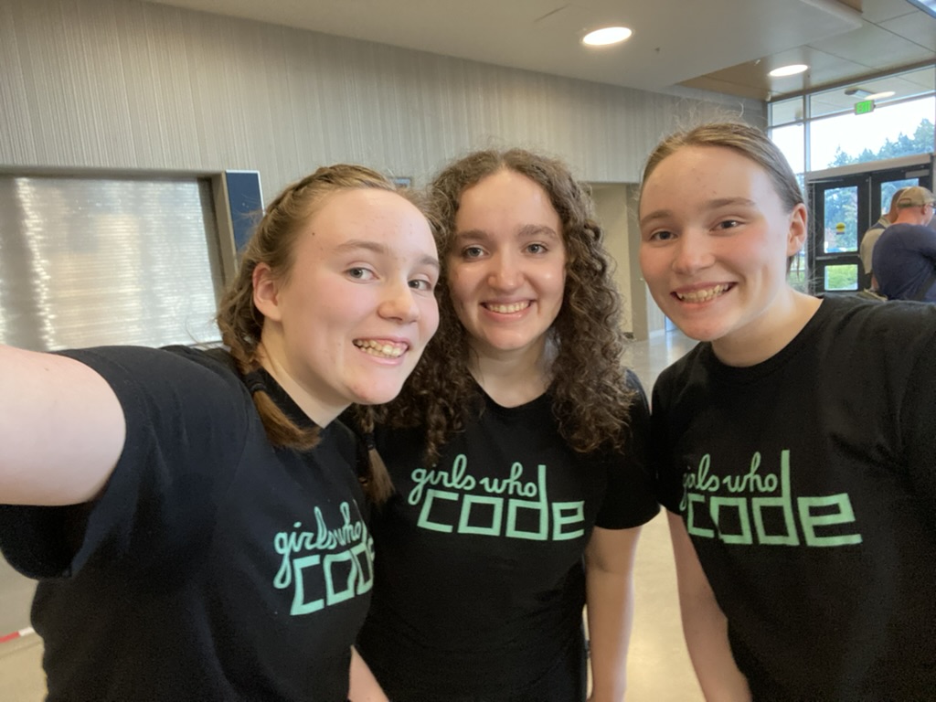 A selfie of three girls in matching Girls Who Code shirts.